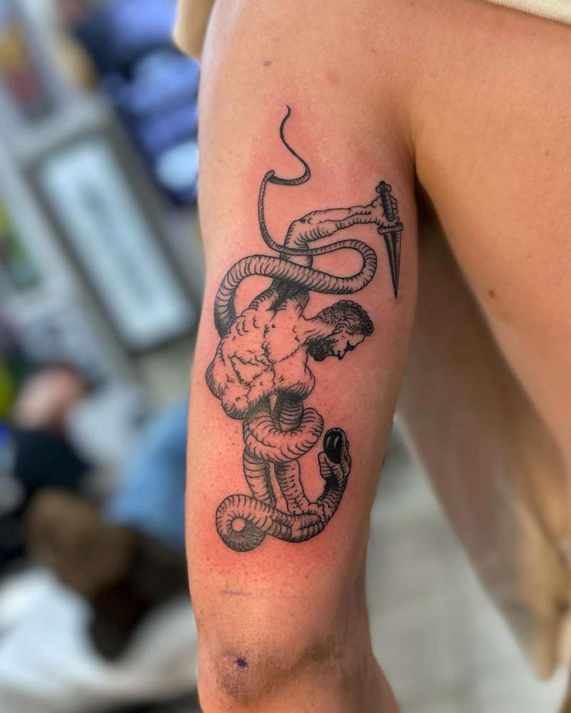mythological creature tattoo on upper arm