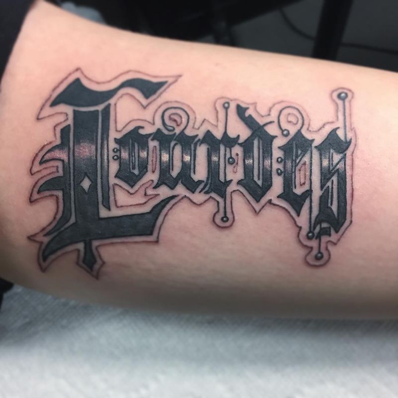 lettering tattoo on forearm