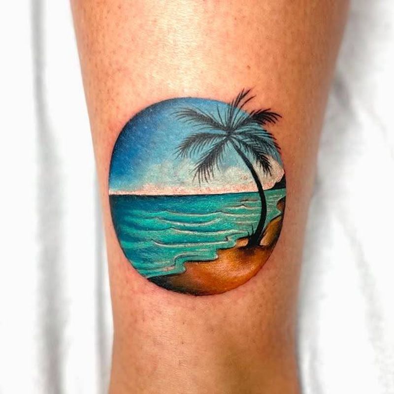 minimalist color beach scene tattoo on calf