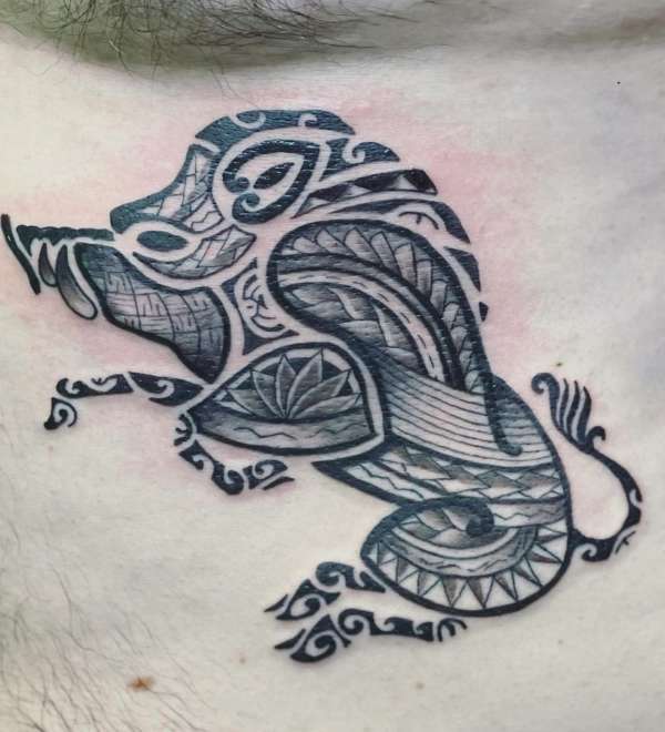 Blackwork tribal and geometric panther tattoo on chest