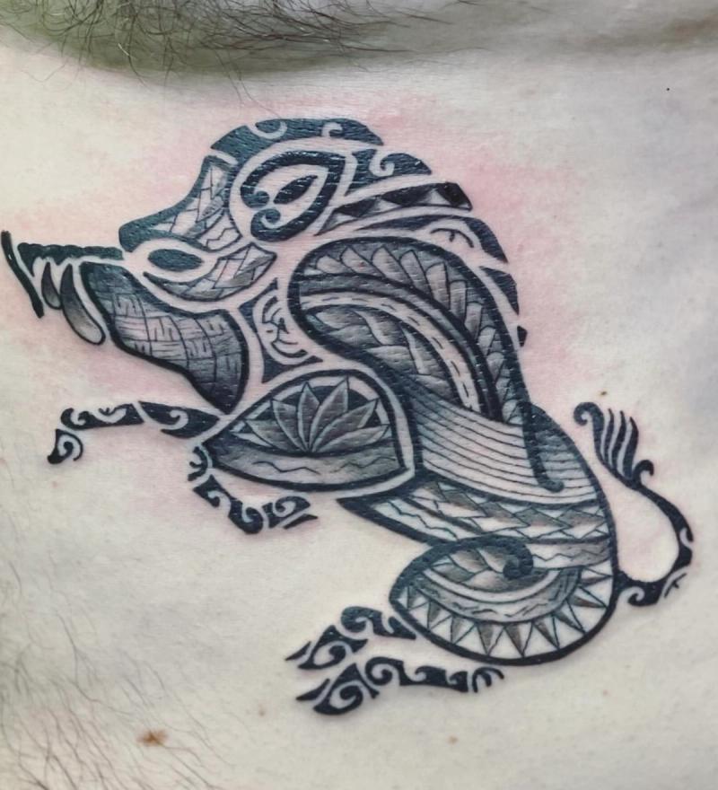 Blackwork tribal and geometric panther tattoo on chest