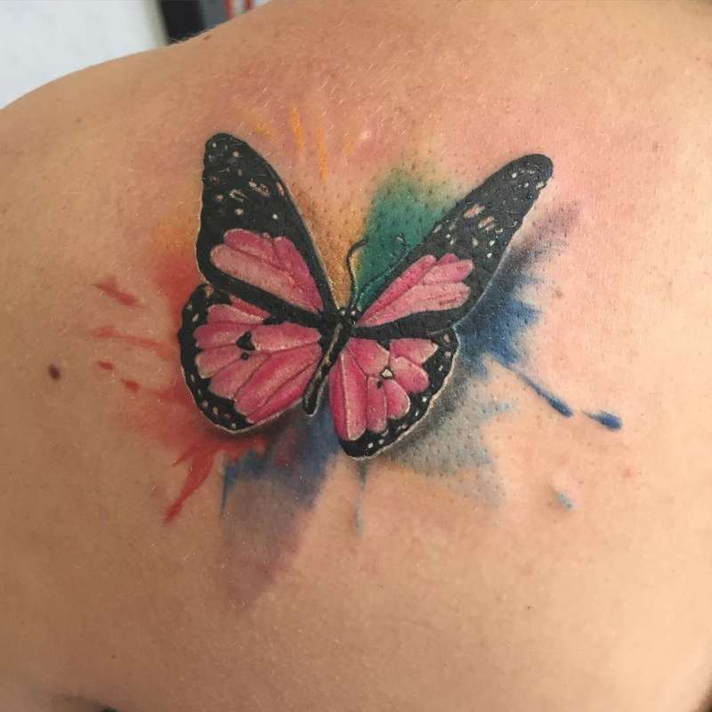 butterfly tattoo with watercolor effect on back