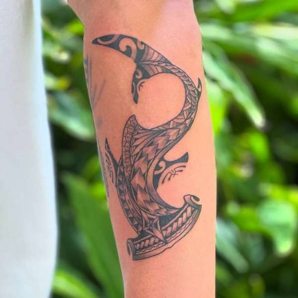 Tribal blackwork shark tattoo on forearm