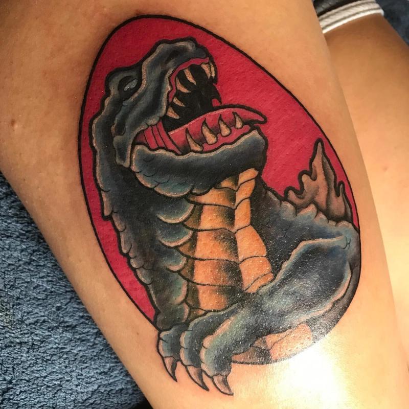 colorful reptile tattoo on thigh