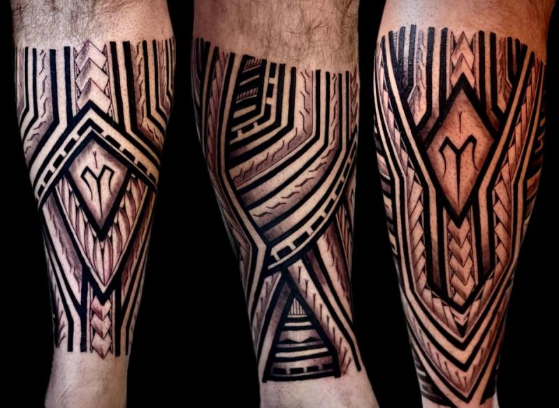 Blackwork tribal and geometric design on calf