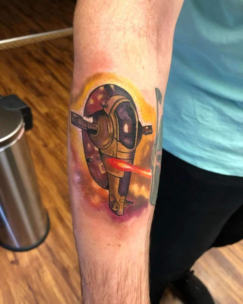 colorful sci-fi helmet tattoo on forearm