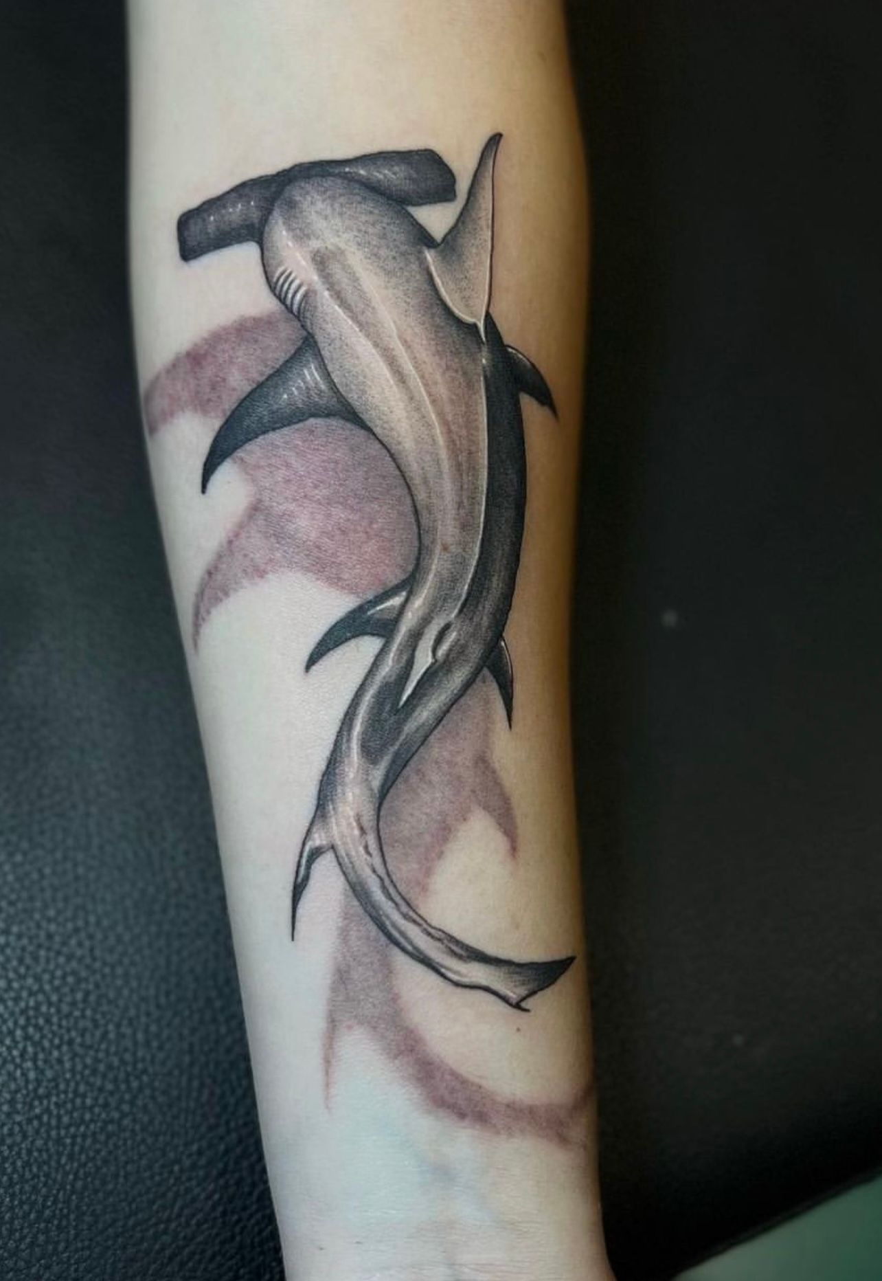 Black and grey realistic hammerhead shark tattoo on forearm