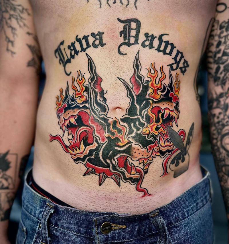 colorful dragon and lettering tattoo on torso