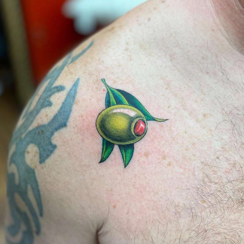 colorful olive tattoo on shoulder