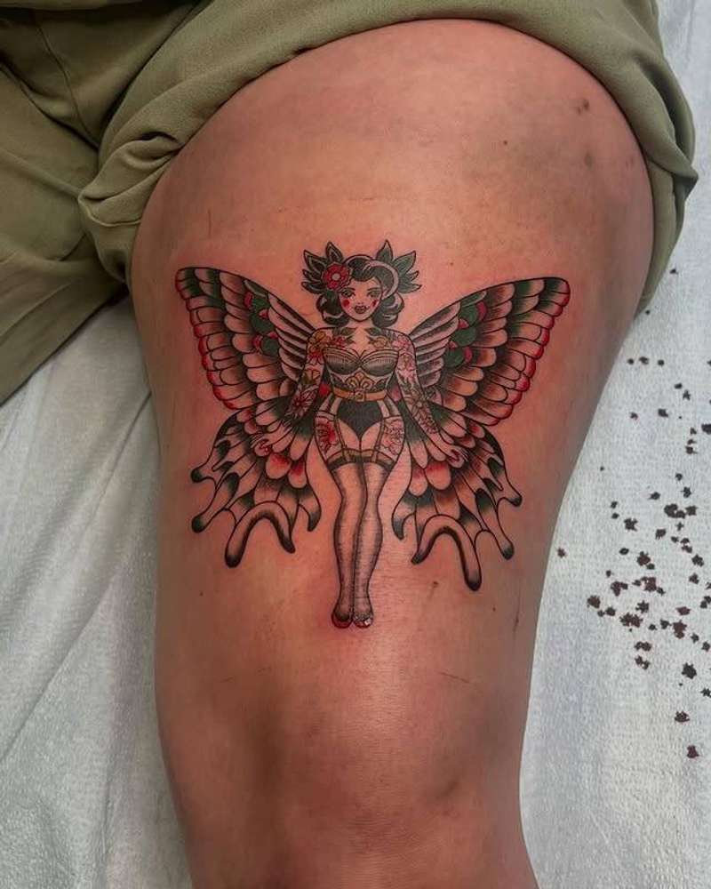 colorful tattoo of a woman with butterfly wings on thigh