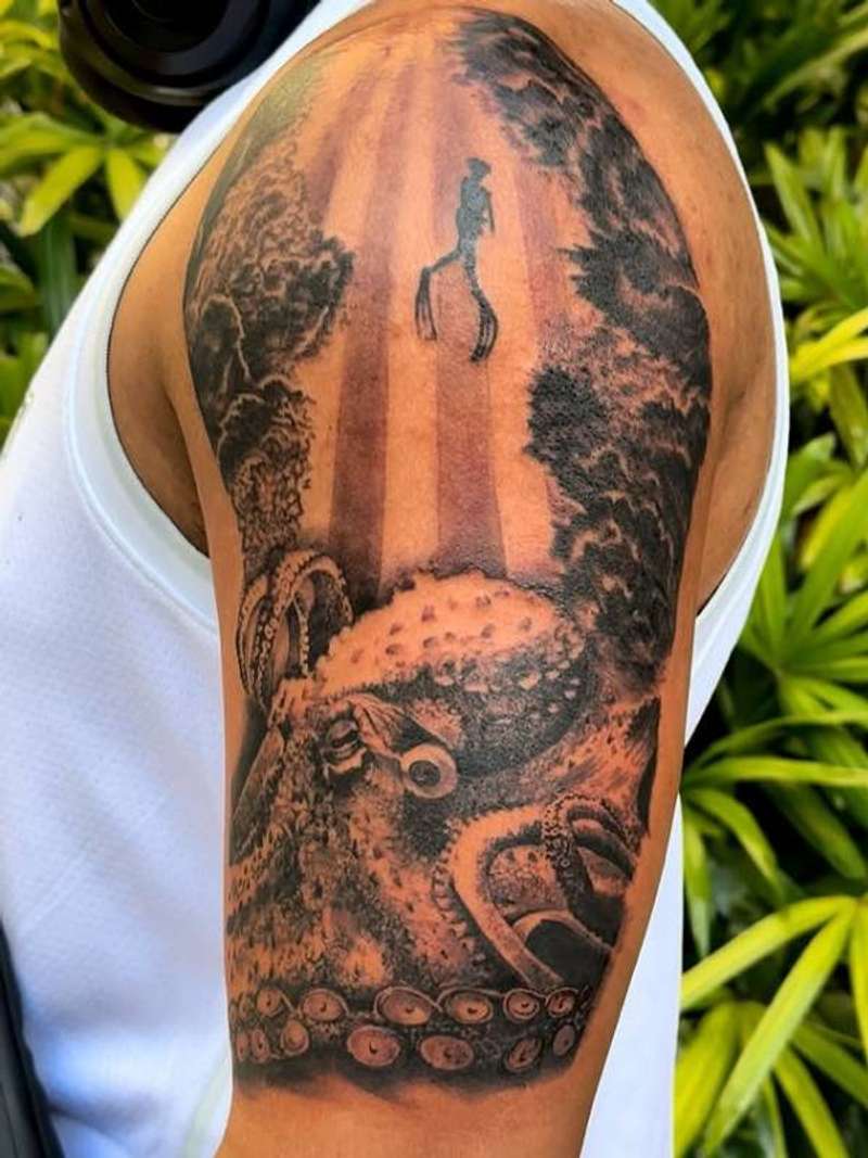 Black and grey realistic octopus on upper arm