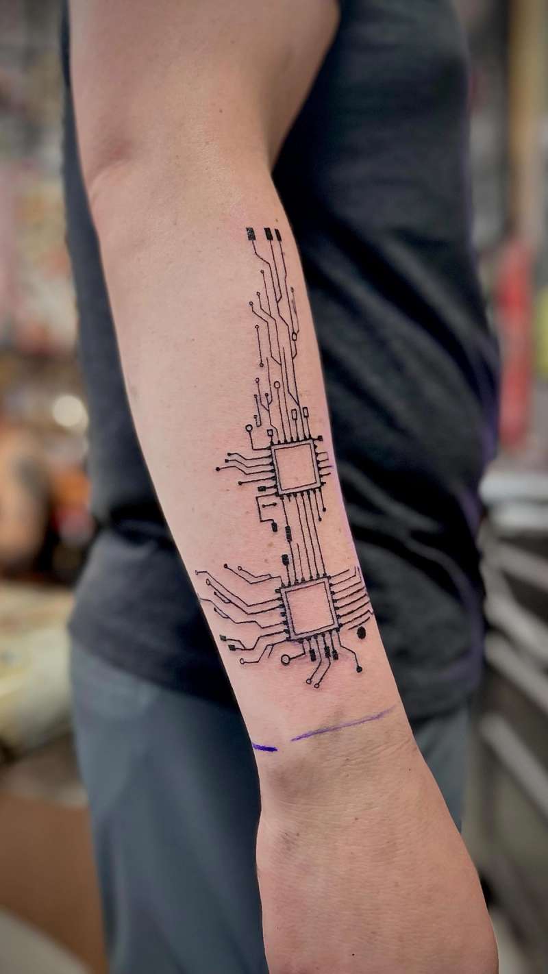 circuit board tattoo on forearm