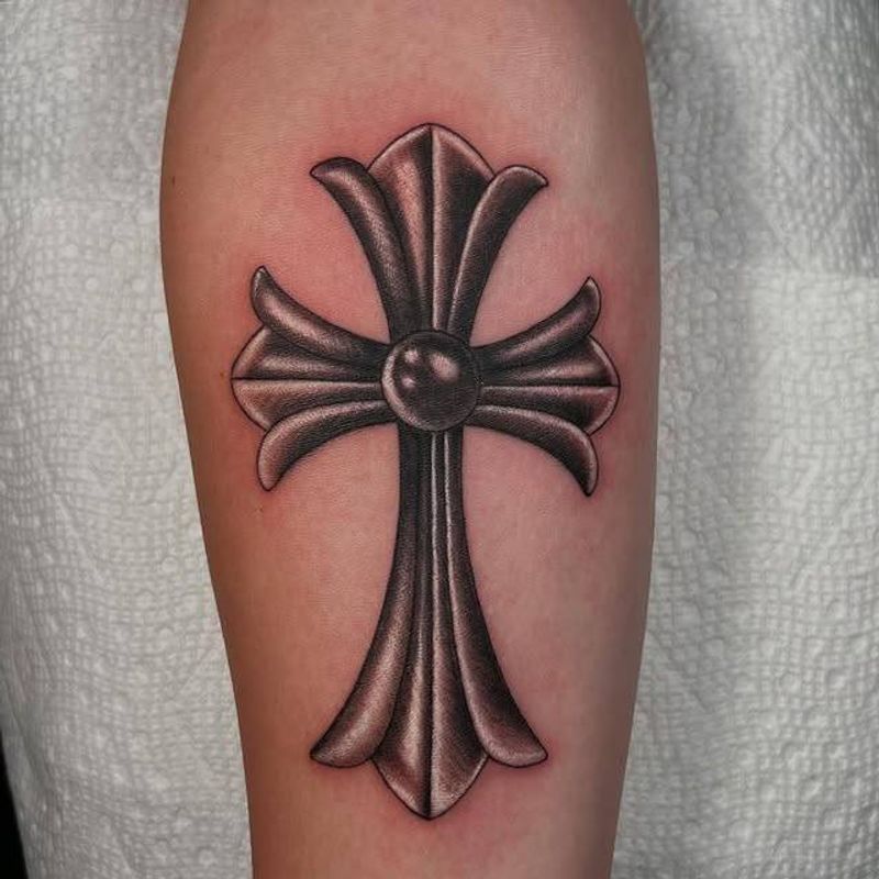 Black and grey realistic cross tattoo on forearm