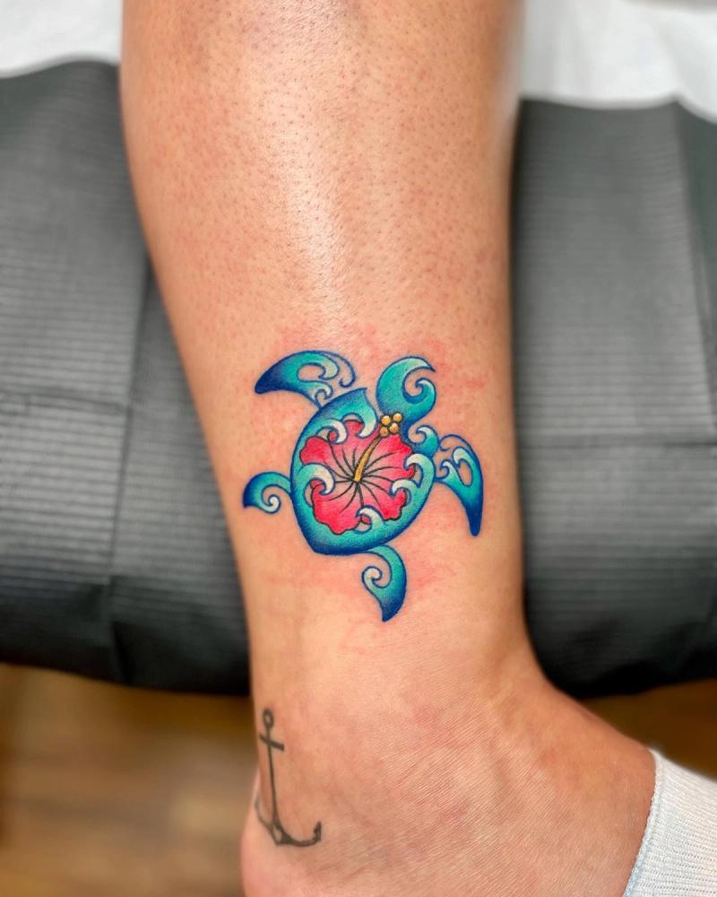colorful turtle tattoo on the leg calf