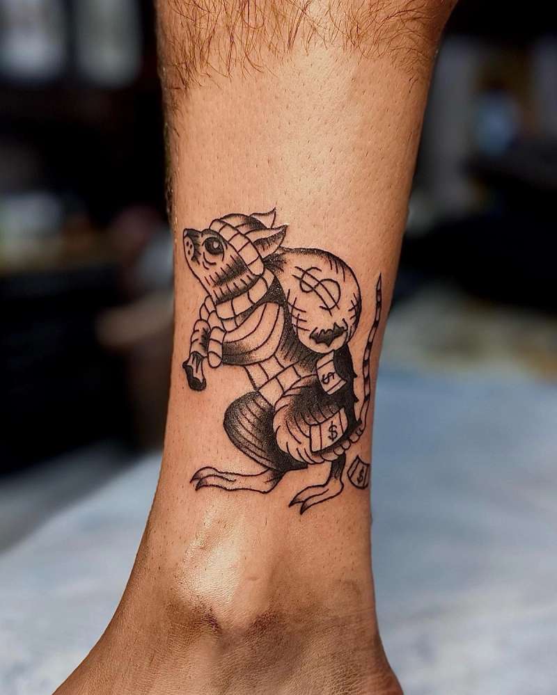 blackwork tattoo of a rat in armor on calf