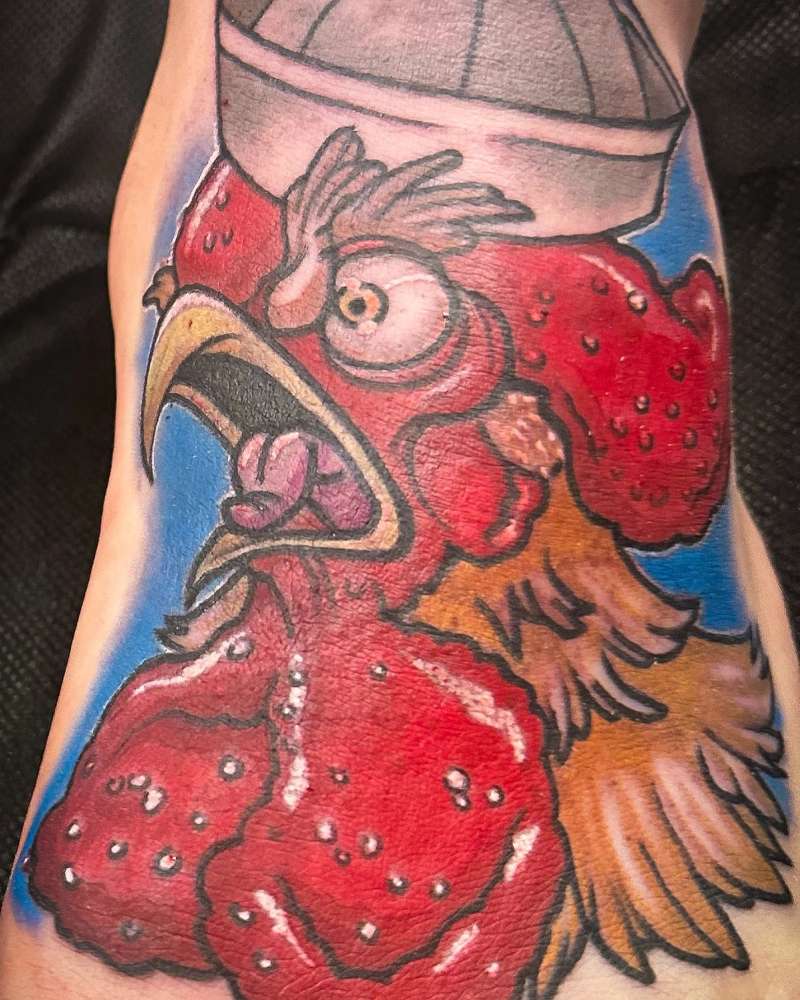colorful rooster tattoo on calf