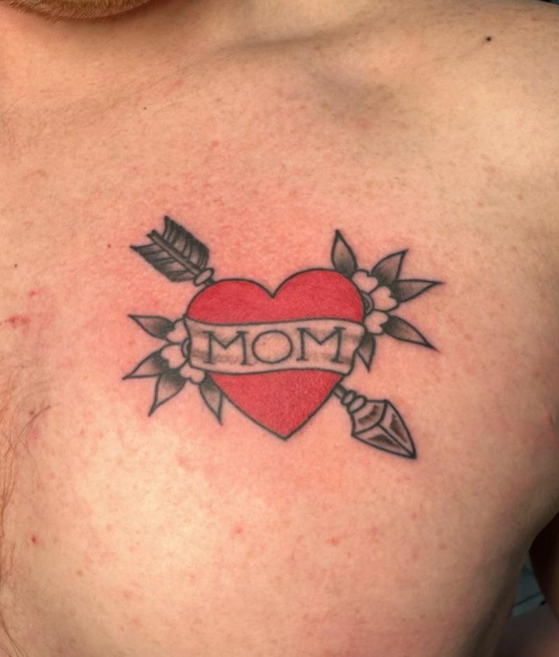 traditional heart with mom banner tattoo on chest