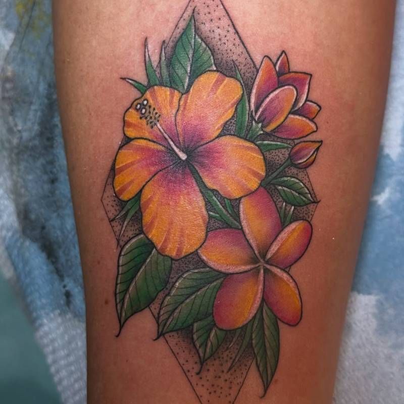 Colorful floral tattoo with neo traditional style on calf