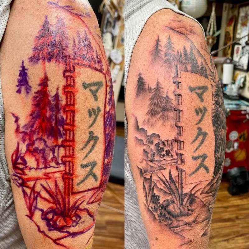 japanese landscape tattoo on upper arm with trees