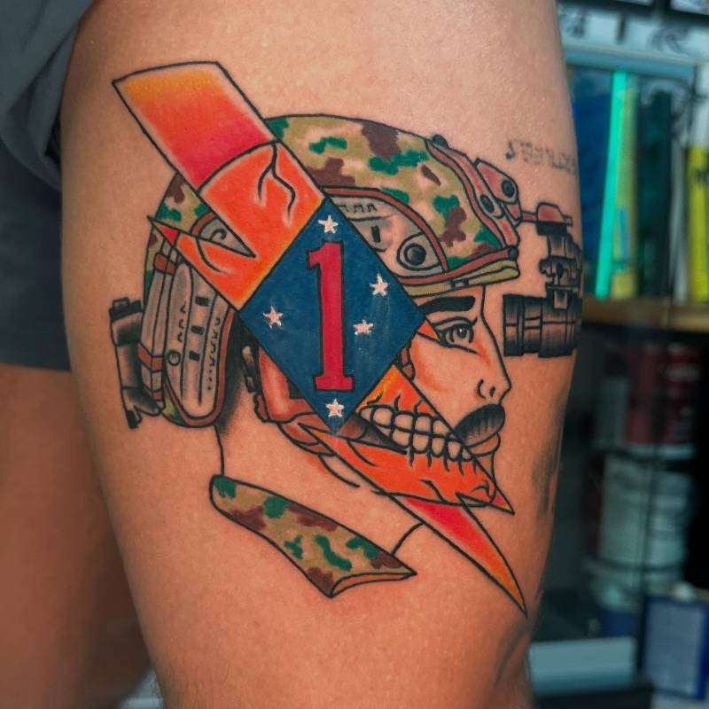 military themed colorful tattoo on thigh