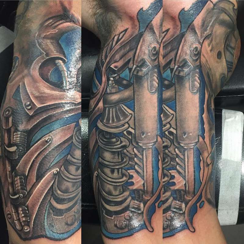 biomechanical tattoo on a full arm sleeve