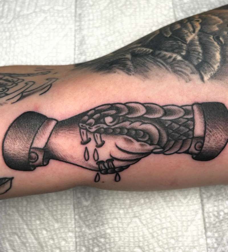Blackwork traditional shaking hands tattoo on forearm