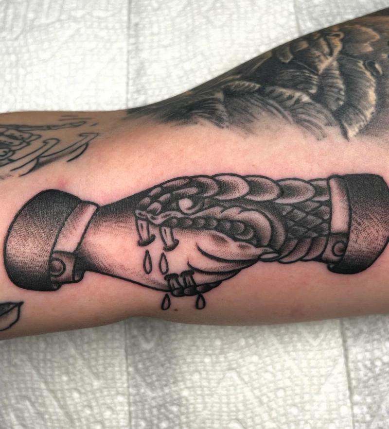 Blackwork traditional shaking hands tattoo on forearm