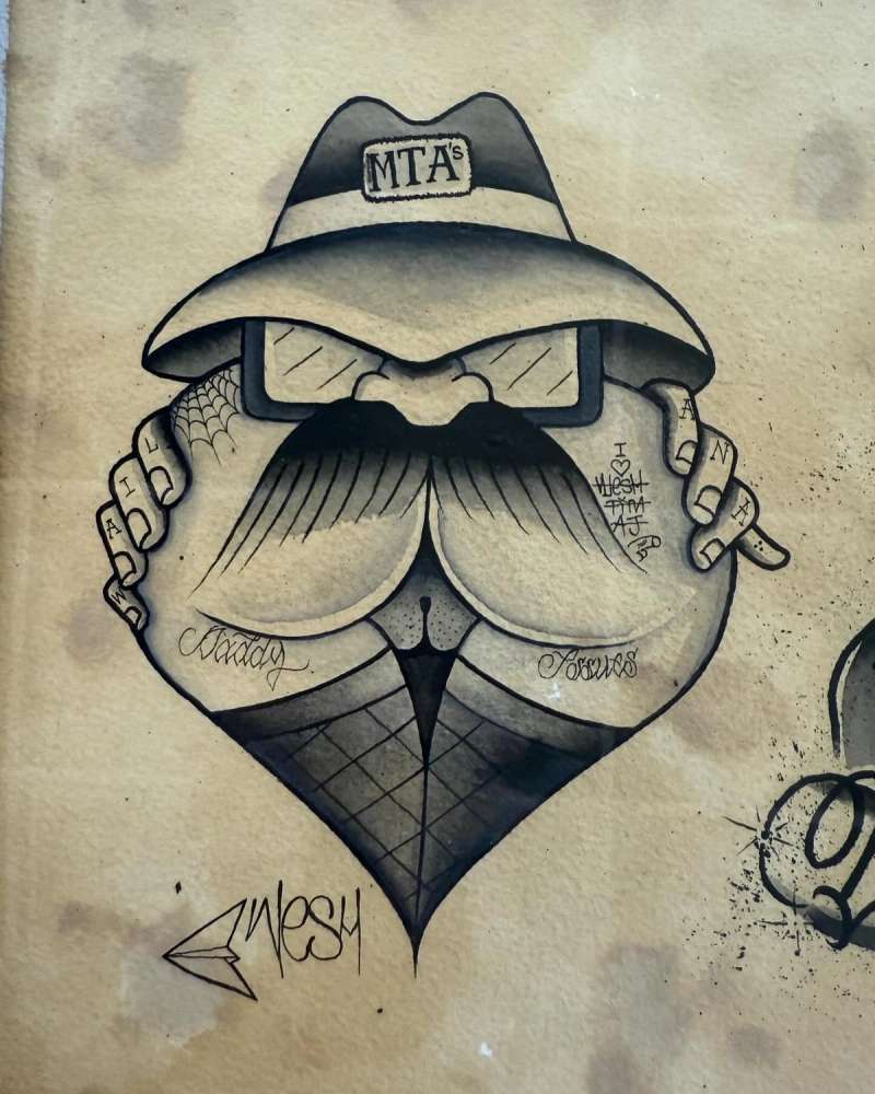 Black and grey illustrative cartoon face tattoo