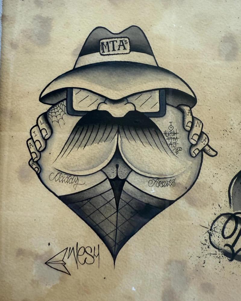 Black and grey illustrative cartoon face tattoo