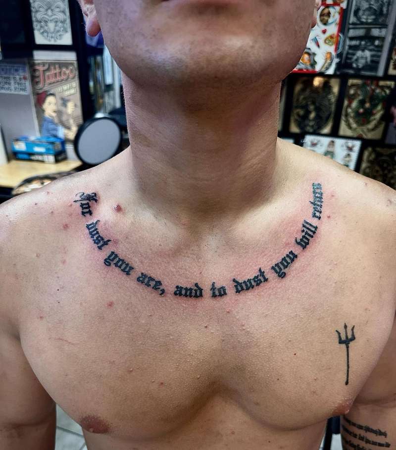 text tattoo with quote on collarbone