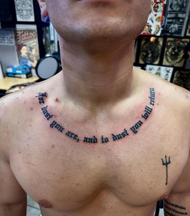 text tattoo with quote on collarbone