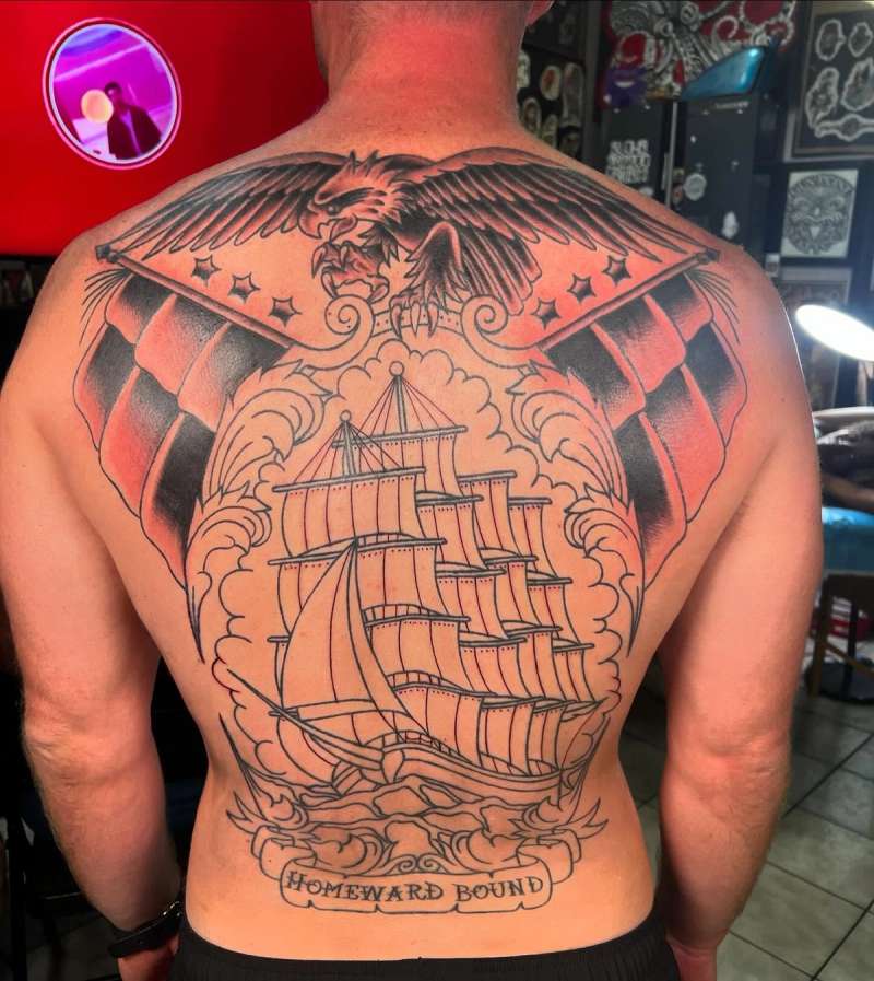 Colorful traditional eagle and ship tattoo covering entire back