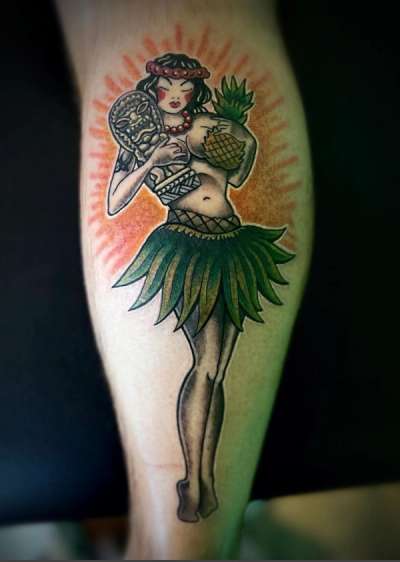 Traditional colorful hula girl tattoo on calf
