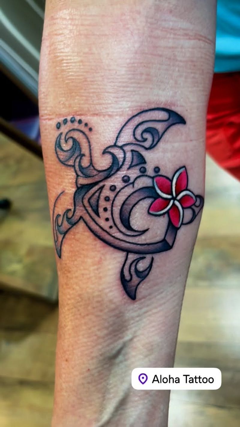 tribal turtle tattoo on forearm