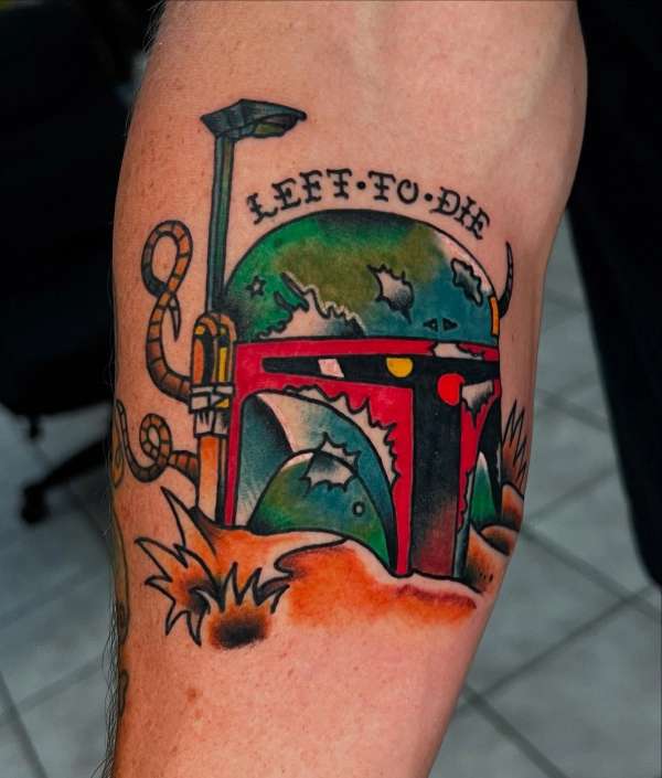 colorful space themed tattoo on upper arm