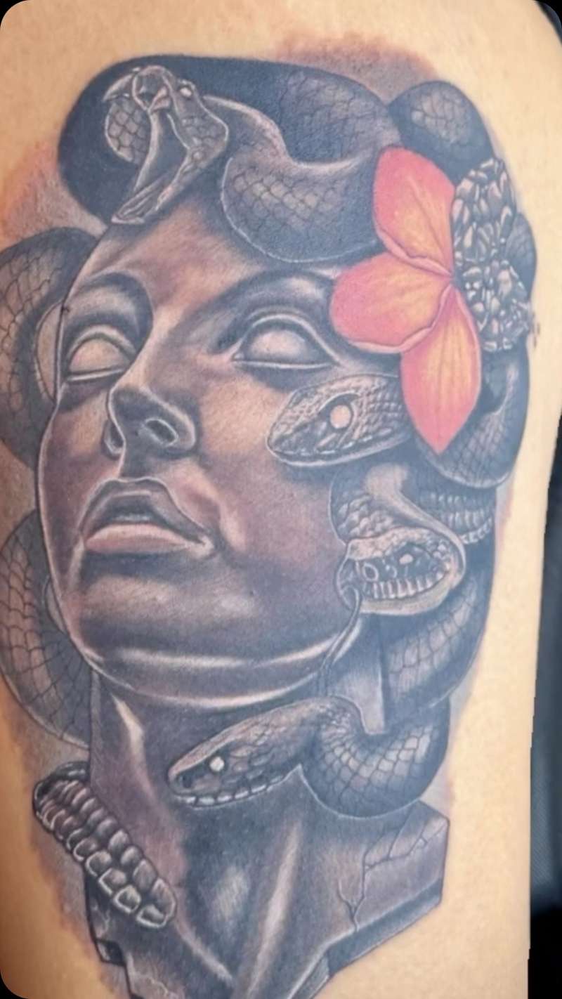 realistic medusa tattoo on upper arm