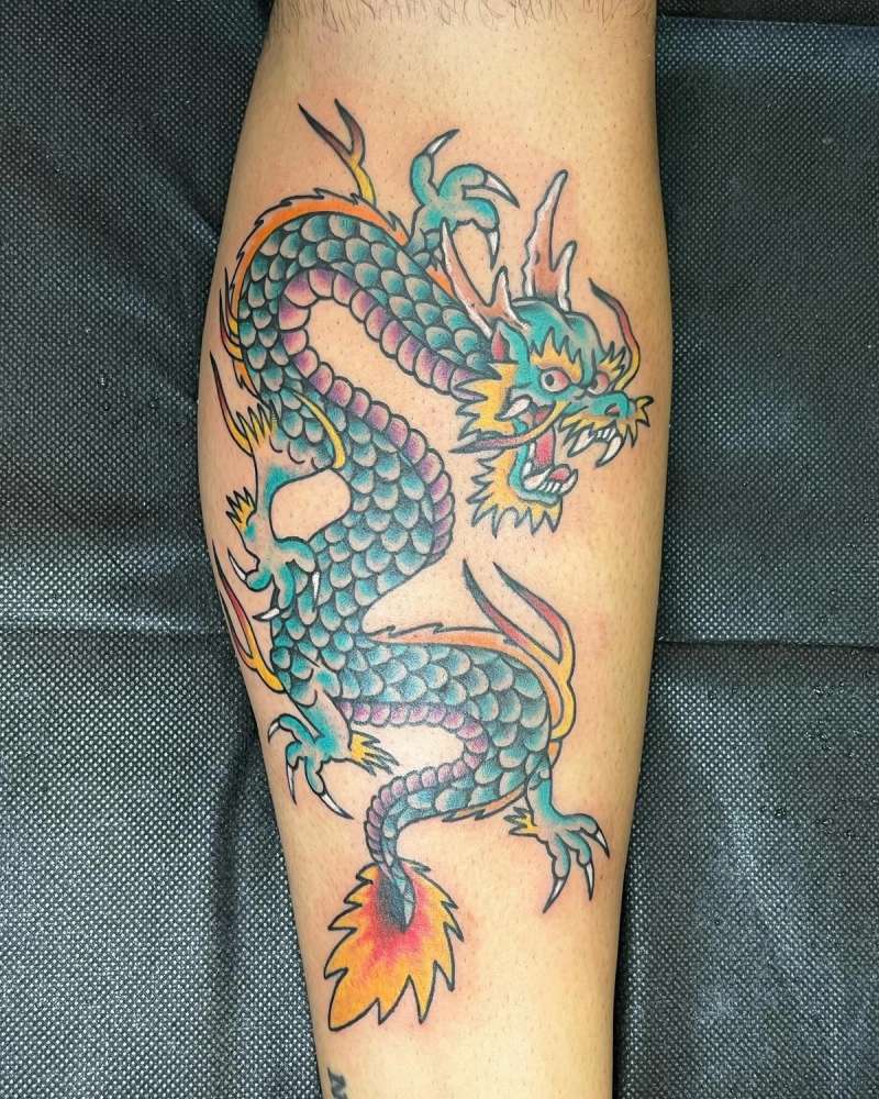 Colorful Japanese traditional dragon tattoo on calf