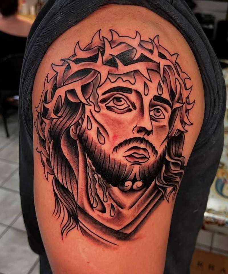 Black and grey illustrative Jesus portrait with red accents on upper arm