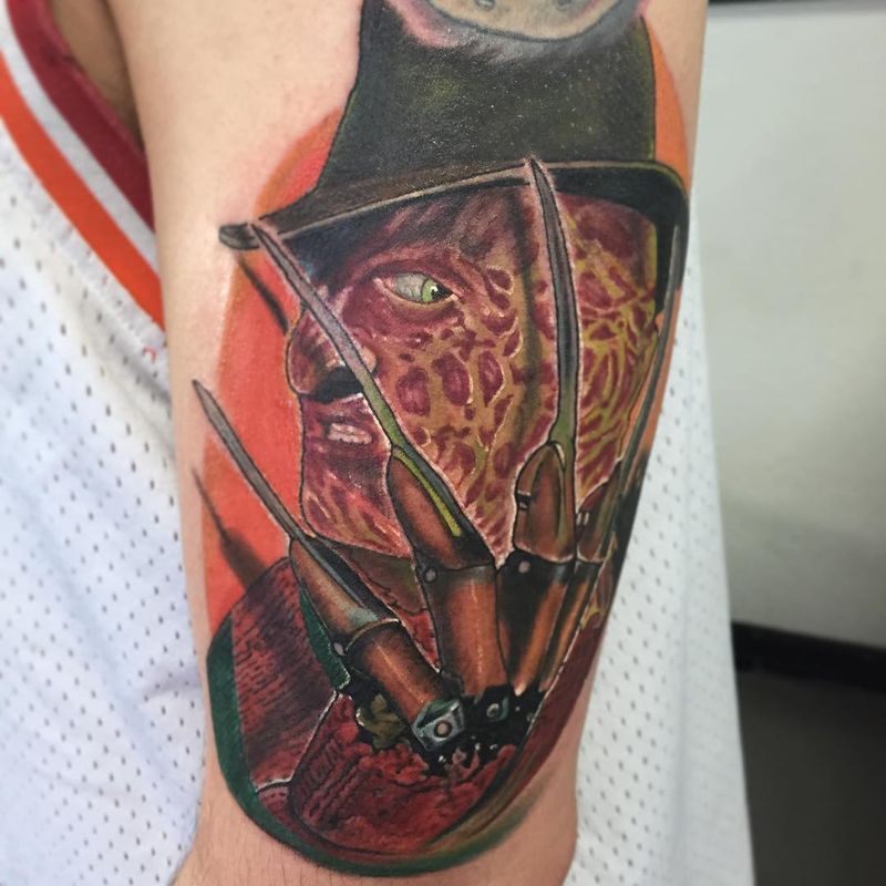 realistic horror character tattoo on upper arm