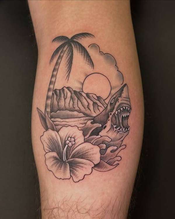 Black and grey traditional shark and palm tree tattoo on calf