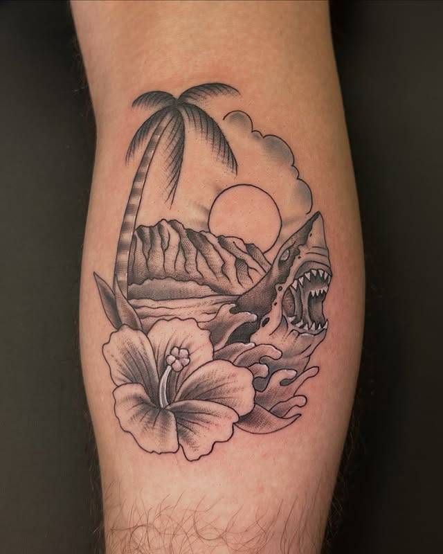 Black and grey traditional shark and palm tree tattoo on calf