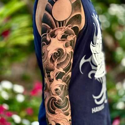 Black and grey Japanese traditional wave full sleeve tattoo