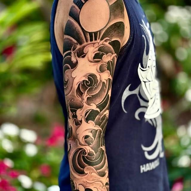 Black and grey Japanese traditional wave full sleeve tattoo
