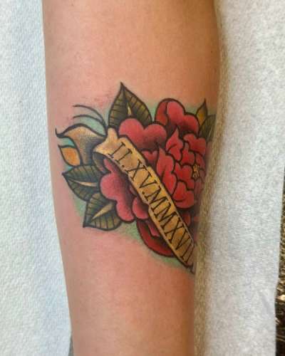 colorful traditional rose tattoo with date