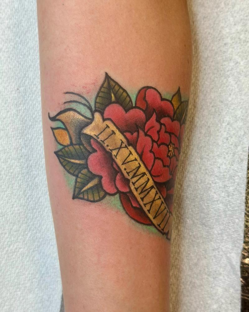 colorful traditional rose tattoo with date