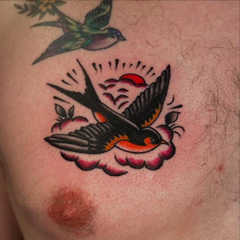 traditional swallow tattoo on chest