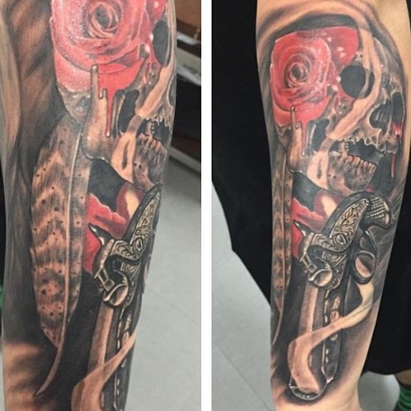 realistic skull and rose tattoo on full arm sleeve