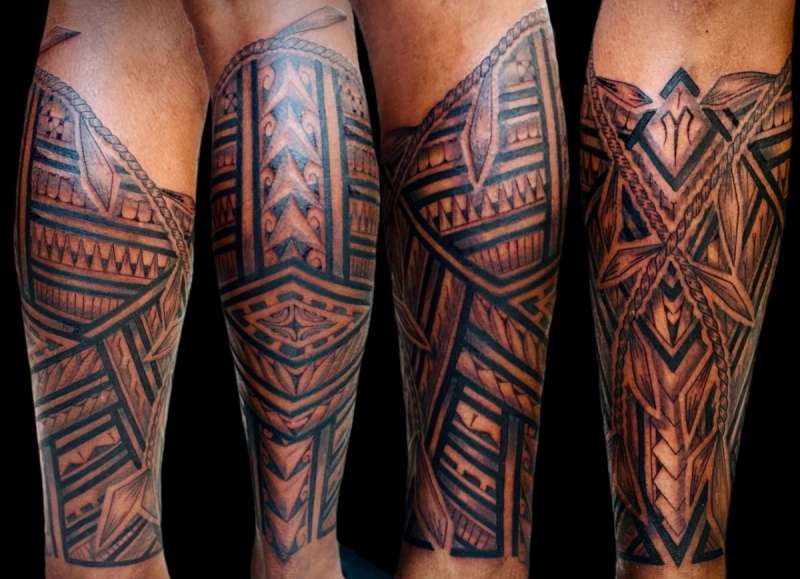 Tribal black and grey tattoo sleeve on calf