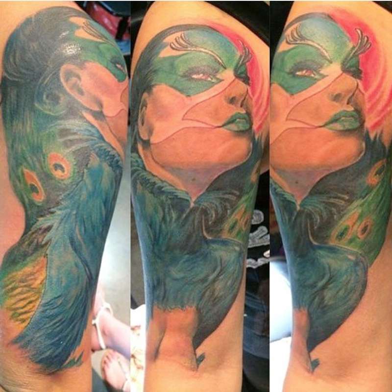 colorful peacock woman tattoo on full sleeve