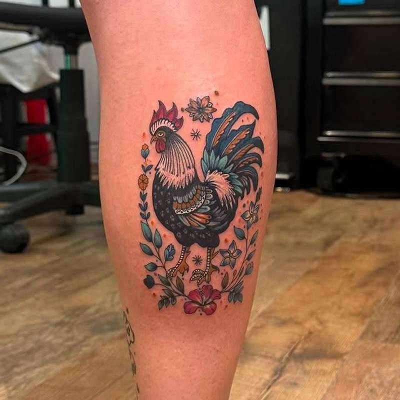 Colorful Neo Traditional rooster with flowers on calf.